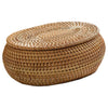 Handwoven rattan storage basket with a lid, made of natural tan fibers.