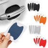 A hand holds a carbon fiber car door handle protector film in various colors and textures.