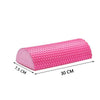 Pink half-round EVA foam roller used for muscle relief and yoga balance
