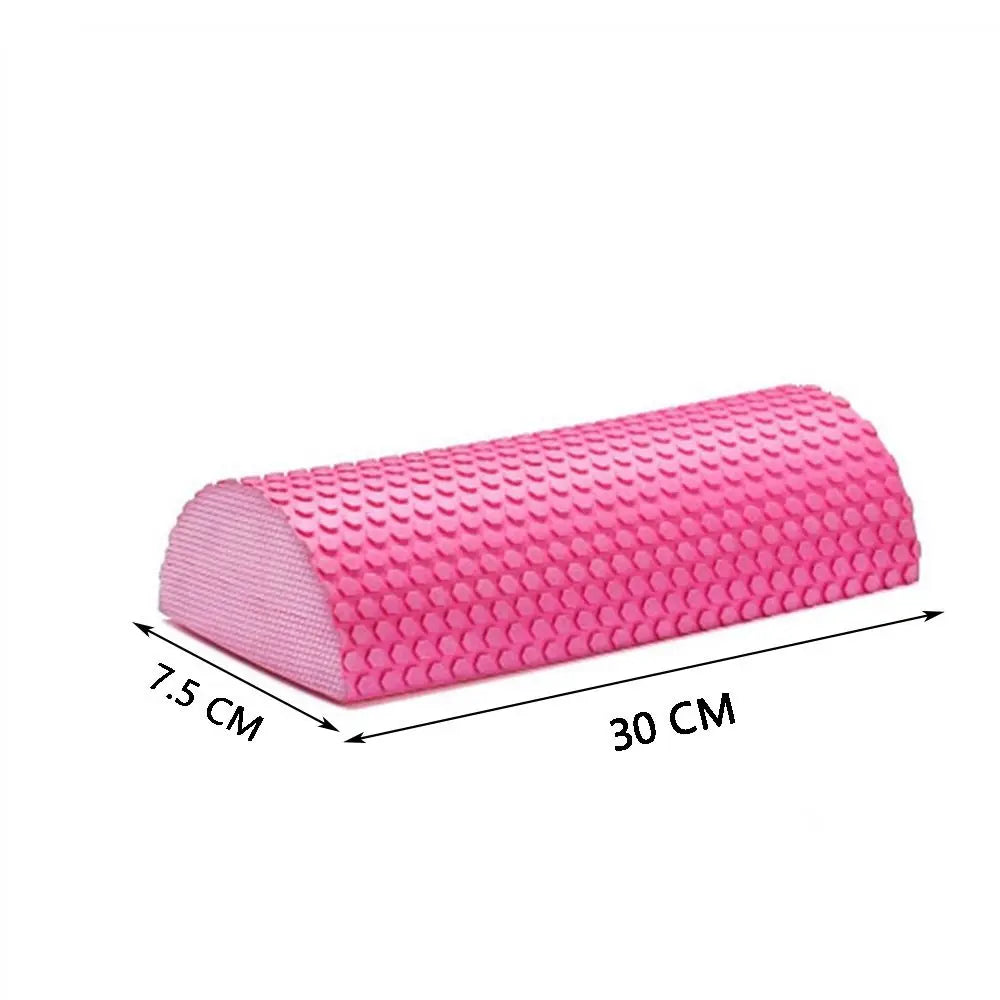 Pink half-round EVA foam roller used for muscle relief and yoga balance