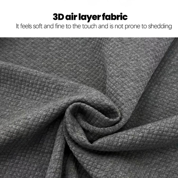 A close-up of a dark gray 3D air layer fabric material folded and draped.