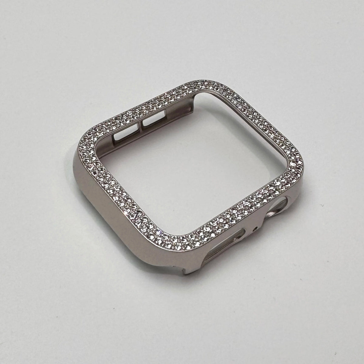Carcasa de borde con pedrería brillante plateada para Apple Watch, vista desde arriba.