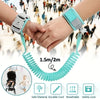 A pair of hands holding a teal wrist link strap for toddlers, demonstrating its 1.5m/2m length and features.