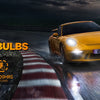 A yellow sports car with bright LED headlights is shown on a racetrack, highlighting Fahren H11/H8/H9 LED light bulbs.
