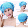 A woman is wearing a bright blue microfibre quick-dry hair towel wrap with a bowknot on her head.
