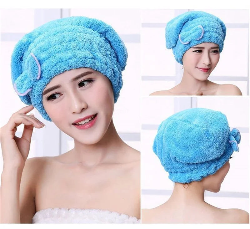 A woman is wearing a bright blue microfibre quick-dry hair towel wrap with a bowknot on her head.