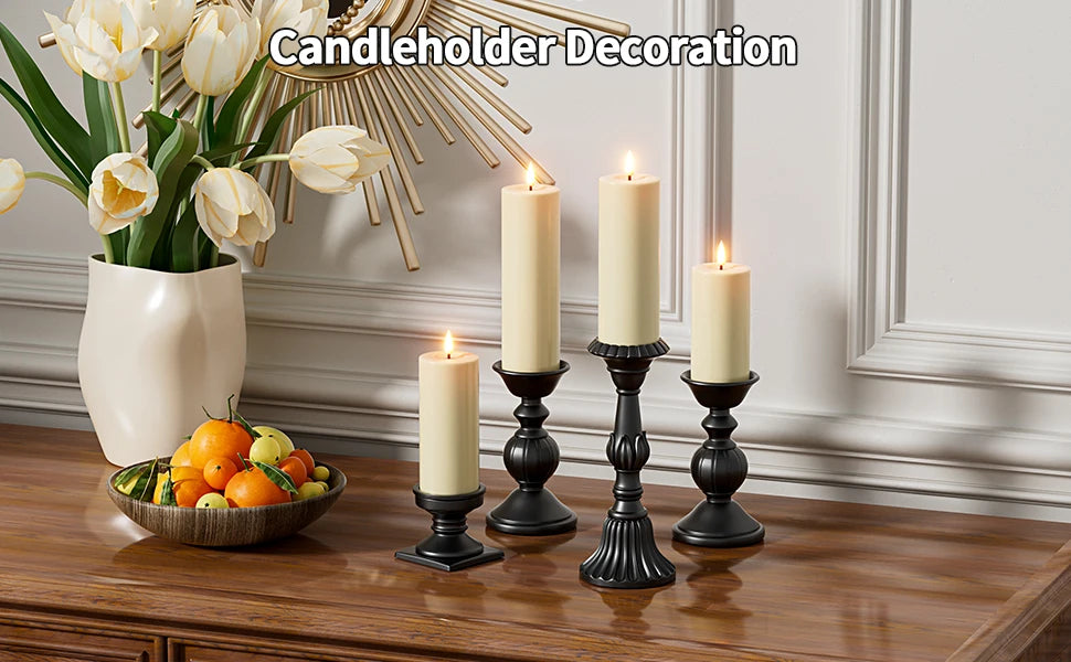 A set of pillar candles in a decorative candelholder arrangement on a wooden table.