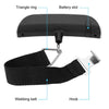 A black portable digital luggage scale featuring a triangle ring, battery slot, webbing belt, and hook.