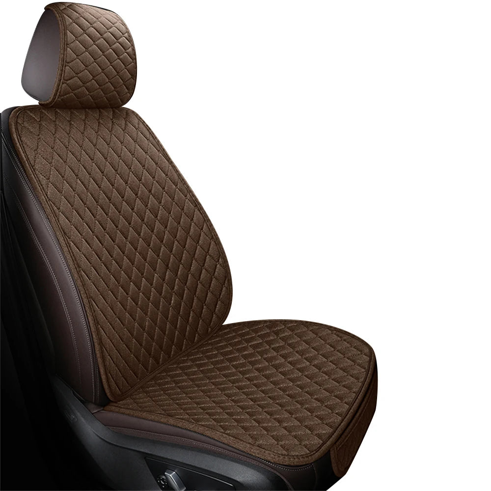 A close-up view of a dark brown quilted car seat cover set.