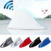 A set of five shark fin car antennas in various colors including silver, red, black, and blue