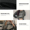 A close-up of a gray sweatshirt with black text, showing the fabric texture and fit.