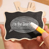 A hand holds a mini wooden chalkboard sign with the text I'm the lead written on it.