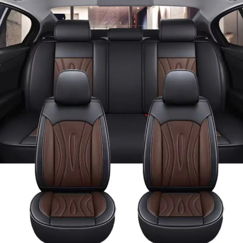 A pair of black full coverage PU leather car seat covers shown in the interior of a car.