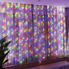 Purple and pink LED curtain lights with colorful twinkling lights covering a window or wall.