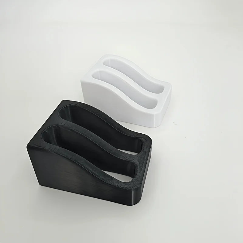 A black double slot wall-mounted wrench organizer rack next to a white version.