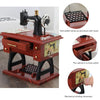 A wooden clockwork sewing machine music box with a foot pedal and mechanical winding movement.