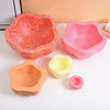A set of colorful, textured plastic stepping stones in red, pink, and orange for kids' sensory and motor skill development.