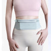 A woman models a light pink sports bra and a light blue running waist pack over beige leggings.