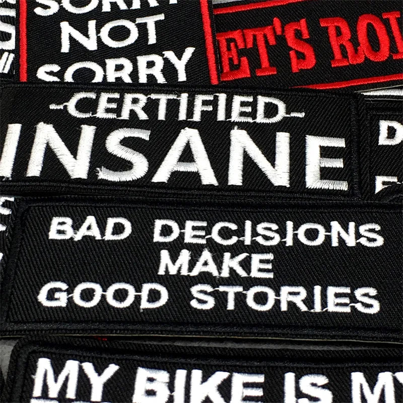 A collection of black text embroidery patches featuring phrases like NOT SORRY INSANE BAD DECISIONS MAKE GOOD STORIES and MY 