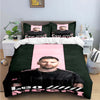 A dark green duvet cover featuring a man's portrait and text on the front.