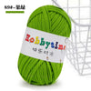 A ball of bright green soft T-shirt yarn used for crochet and knitting projects.