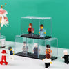A clear acrylic display case holds various miniature figurines and collectibles on a black base.