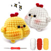 A beginner crochet kit featuring two stuffed yellow and white chick figures with a needle.