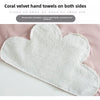 Coral velvet hand towels on both sides shown against a pink background