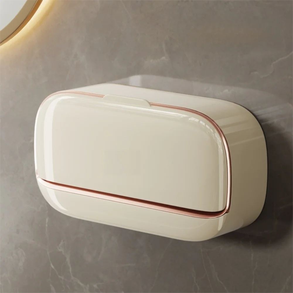 A rectangular, cream-colored wall mounted soap dish with a copper rim is displayed against a gray marble background.