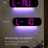 A digital wall clock displays 'L-AU' and 'L-10' options for auto and manual brightness adjustment.