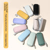 A collection of flat six-fold umbrellas in various colors, including white, yellow, purple, pink, and mint green, shown with 