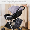 A portable and foldable stroller hanging design featuring a gray baby changing pad and storage bag.