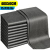 A stack of dark gray reusable microfiber glass cleaning cloths.