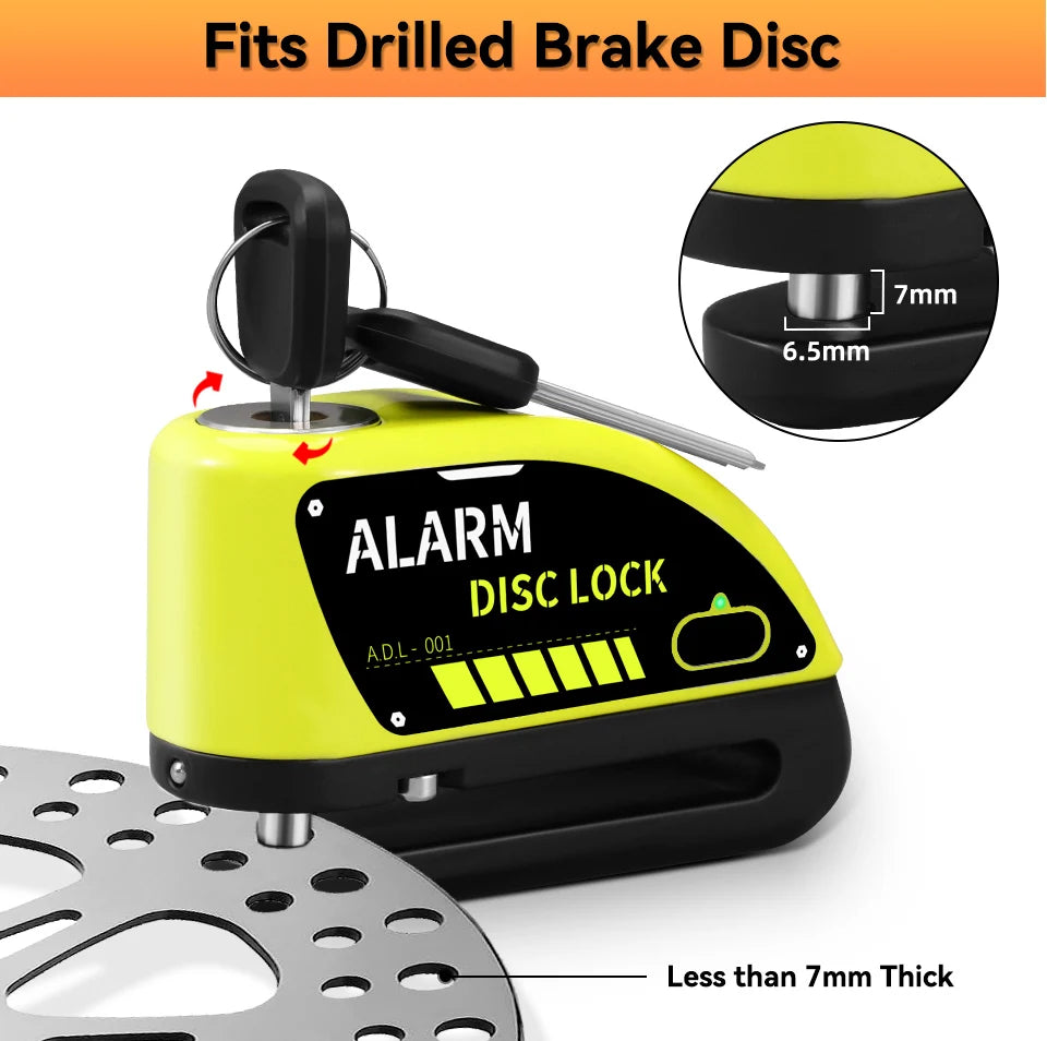 Yellow motorcycle disc brake lock with an alarm feature and a silicone grip shown next to a brake disc.