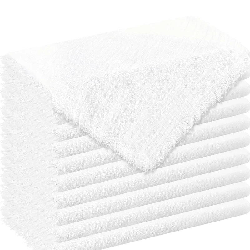 A stack of white raw-edge polyester cloth napkins, showing the textured fabric and folded edges.