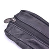 A close-up view of a black leather compact zippered coin purse with a metal key holder.