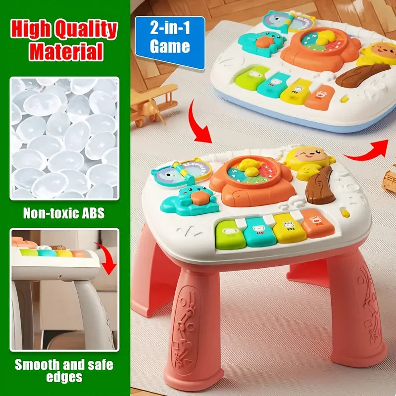 A white baby interactive activity table featuring a piano and steering wheel components for children.