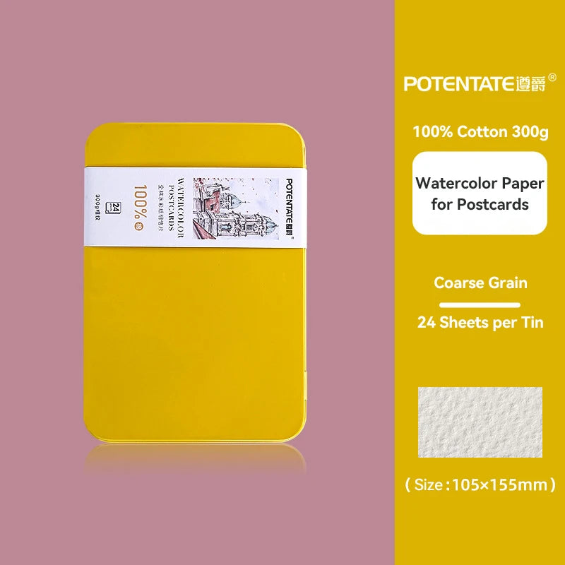 A yellow tin box containing 24 sheets of 100% cotton watercolor paper for postcards.