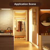 Interior scene showing a modern bathroom or closet with recessed LED lighting and wooden cabinetry.