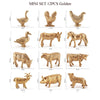A set of twelve gold-colored realistic animal figurines, including a turkey, goose, deer, and various farm animals.