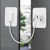 A white self-adhesive window safety lock with two keys mounted on a gray door frame.