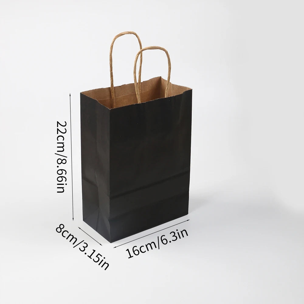 A black kraft paper gift bag with natural twine handles shown from above.