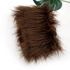 A pile of dark brown soft faux fur fabric used for DIY sewing, doll hair, and cosplay.