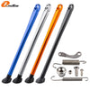 Set of four aluminum motorcycle side stand kits in blue, silver, orange, and black with ABS feet