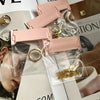 Pink self-sealing storage bags for jewelry including rings, necklaces, and bracelets displayed on a magazine page.
