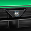 A close-up view of a black protective cover for a car camera, featuring a round lens with blue illumination.
