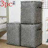 Three quilted storage bags in black and white houndstooth pattern standing vertically.