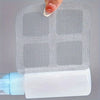 A hand is placing a disposable drain hair catcher sticker onto a white plastic bottle.