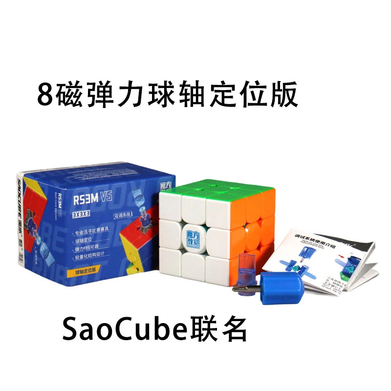 A box of MoYu RS3M V5 3x3 magnetic speed cubes and loose blue cube pieces.