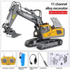 A yellow and gray 11 channel alloy excavator toy set with a remote control, battery, and USB charging cable.